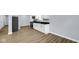 Modern kitchen featuring new flooring, grey paint and stainless steel appliances at 3106 N Harding St, Indianapolis, IN 46208