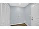 Clean laundry area features a new closet, vinyl plank flooring, and washer/dryer hookups at 3106 N Harding St, Indianapolis, IN 46208