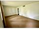 A bright living room with carpeted floors offers a spacious area at 3325 Canaday Dr, Anderson, IN 46013