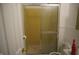 Bathroom with a glass door shower and white toilet at 3612 Carolee Ct, Indianapolis, IN 46227