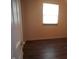 Cozy bedroom features updated flooring and a window for natural light at 3612 Carolee Ct, Indianapolis, IN 46227