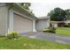 Home with attached garage, beautiful landscaping, and well-manicured lawn at 3612 Carolee Ct, Indianapolis, IN 46227