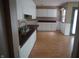Eat-in Kitchen with white cabinets and white paneled walls at 3612 Carolee Ct, Indianapolis, IN 46227