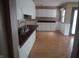 Eat-in Kitchen with white cabinets and white paneled walls at 3612 Carolee Ct, Indianapolis, IN 46227