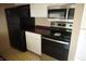 Kitchen with stainless steel oven and microwave and black refrigerator at 3612 Carolee Ct, Indianapolis, IN 46227