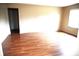 Bright living room with wood-look flooring and neutral wall paint at 3612 Carolee Ct, Indianapolis, IN 46227