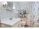 Quaint bathroom featuring a vanity, toilet, and fern themed wallpaper at 3801 N Vernon Dr, Muncie, IN 47304