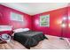 Vibrant bedroom with hardwood floors and a large bed at 3801 N Vernon Dr, Muncie, IN 47304