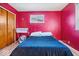 Bright bedroom featuring wood floors and a large window at 3801 N Vernon Dr, Muncie, IN 47304