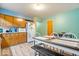 Cozy kitchen with dining table and oak cabinets at 3801 N Vernon Dr, Muncie, IN 47304