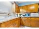 Close up of kitchen featuring oak cabinets and a white countertop sink at 3801 N Vernon Dr, Muncie, IN 47304