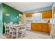 Charming eat-in kitchen featuring laminate flooring and updated appliances at 3801 N Vernon Dr, Muncie, IN 47304