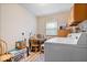 Laundry room features a white washer and dryer, cabinets, and a table with chairs for added convenience at 3801 N Vernon Dr, Muncie, IN 47304