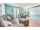 Inviting living room featuring two couches, large windows, and minimalist design at 3801 N Vernon Dr, Muncie, IN 47304