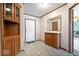 Inviting entryway featuring tile floors, built-in cabinets, and a mirror, enhancing the space's functionality at 4244 Asbury St, Indianapolis, IN 46227