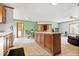Open concept kitchen featuring a central island and a combined kitchen, dining, and living space at 4244 Asbury St, Indianapolis, IN 46227