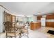 Open-concept living and kitchen area featuring an island, dining table, and comfortable seating at 4244 Asbury St, Indianapolis, IN 46227