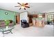 Cozy living room with plush carpet, comfortable seating, and an adjacent kitchen for easy entertaining at 4244 Asbury St, Indianapolis, IN 46227