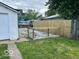 View of fenced backyard area with partial gravel and grass at 427 N Alton Ave, Indianapolis, IN 46222