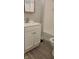 Bright bathroom features a vanity, a sink, a toilet and a tub with classic white subway tile surround at 427 N Alton Ave, Indianapolis, IN 46222