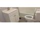 Clean bathroom featuring a white vanity, toilet, and a tiled tub and shower at 427 N Alton Ave, Indianapolis, IN 46222