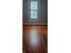Bedroom features recently-refinished hardwood floors and a bright, sunlit window at 427 N Alton Ave, Indianapolis, IN 46222