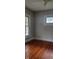 Bedroom with classic hardwood floors, complemented by freshly painted walls, creates a serene and inviting space at 427 N Alton Ave, Indianapolis, IN 46222