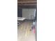Garage interior showing overhead door, lawnmower and workbench at 427 N Alton Ave, Indianapolis, IN 46222
