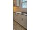This kitchen is equipped with modern white cabinets and a stainless steel double-basin sink at 427 N Alton Ave, Indianapolis, IN 46222