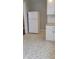 Bright kitchen features a modern white refrigerator and stylish gray hexagon-patterned flooring at 427 N Alton Ave, Indianapolis, IN 46222
