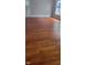 The living room features beautifully refinished hardwood floors and ample natural light at 427 N Alton Ave, Indianapolis, IN 46222