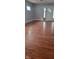 Living room featuring gleaming hardwood floors and a modern entrance, showcasing the home's welcoming ambiance at 427 N Alton Ave, Indianapolis, IN 46222