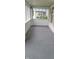 Screened front porch with painted brick accents, offering a cozy space for relaxation and enjoying the outdoors at 427 N Alton Ave, Indianapolis, IN 46222