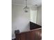 Upstairs hallway featuring a modern light fixture and access to a bedroom at 4303 W County Road 200 S Rd, Danville, IN 46122