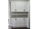 Ample kitchen storage with classic white cabinets, granite countertops, and modern black hardware at 4303 W County Road 200 S Rd, Danville, IN 46122