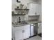 Well-organized kitchen featuring granite counters, stainless dishwasher, and decorative open shelving at 4303 W County Road 200 S Rd, Danville, IN 46122