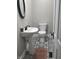 Stylish powder room features a pedestal sink, toilet, and patterned tile flooring at 4303 W County Road 200 S Rd, Danville, IN 46122