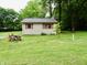Exterior rear view of home with a large yard and trees at 4675 N Herbemont Rd, Martinsville, IN 46151
