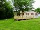 Backyard featuring a new deck and view of the home at 4675 N Herbemont Rd, Martinsville, IN 46151