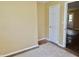Bedroom featuring door, wood trim, and a carpeted floor at 4675 N Herbemont Rd, Martinsville, IN 46151