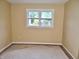 Bedroom with natural light shows neutral colored walls and carpeting at 4675 N Herbemont Rd, Martinsville, IN 46151
