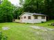 Exterior view of charming home with a large yard and new deck at 4675 N Herbemont Rd, Martinsville, IN 46151