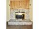 Living room fireplace with stone and wood surround at 4675 N Herbemont Rd, Martinsville, IN 46151