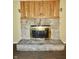 Cozy stone fireplace with a wooden accent mantel, perfect for a warm and inviting atmosphere at 4675 N Herbemont Rd, Martinsville, IN 46151