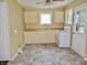 Traditional eat-in kitchen featuring tiled floor, an electric range, and light cabinets and countertops at 4675 N Herbemont Rd, Martinsville, IN 46151