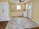Functional kitchen features ample cabinets, an oven, and natural light from windows and the adjacent door at 4675 N Herbemont Rd, Martinsville, IN 46151