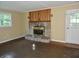Living room features a fireplace, window and exterior door at 4675 N Herbemont Rd, Martinsville, IN 46151