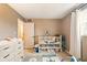Cozy Bedroom with a crib, natural light, and space for play at 4701 Candy Spots Dr, Indianapolis, IN 46237