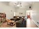 Comfortable living room with a large sectional, vaulted ceilings, and modern decor at 4701 Candy Spots Dr, Indianapolis, IN 46237