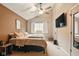 Inviting primary bedroom with vaulted ceiling, natural light, and warm, neutral color palette at 4701 Candy Spots Dr, Indianapolis, IN 46237